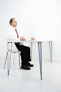 Businessman meditating