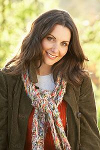 Portrait Of Woman Outdoors In Autumn Landscape