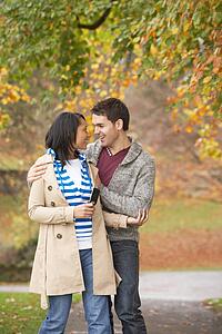 Romantic Teenage Couple In Autumn Park