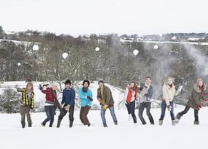 Group Of Teenage Friends Having Fun In Snowy Landscape