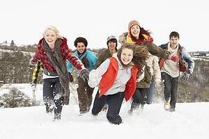 Group Of Teenage Friends Having Fun In Snowy Landscape
