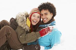 Romantic Teenage Couple Having Fun In Snow