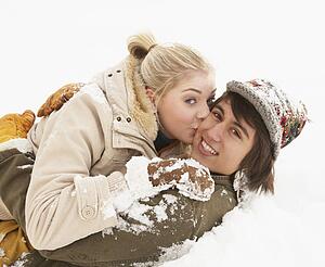 Romantic Teenage Couple Having Fun In Snow