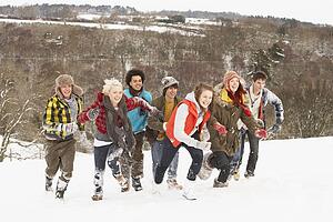 Group Of Teenage Friends Having Fun In Snowy Landscape