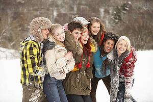 Group Of Teenage Friends Having Fun In Snowy Landscape