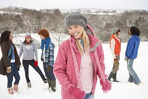 Group Of Young Friends Having Fun In Snowy Landscape