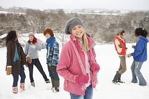 Group Of Young Friends Having Fun In Snowy Landscape