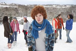 Group Of Young Friends Having Fun In Snowy Landscape