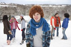Group Of Young Friends Having Fun In Snowy Landscape