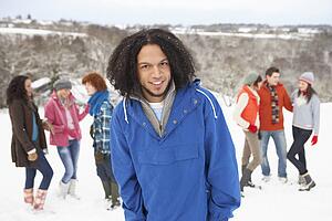 Group Of Young Friends Having Fun In Snowy Landscape