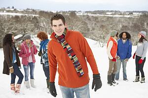Group Of Young Friends Having Fun In Snowy Landscape