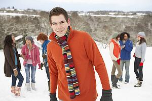 Group Of Young Friends Having Fun In Snowy Landscape