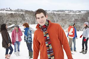 Group Of Young Friends Having Fun In Snowy Landscape