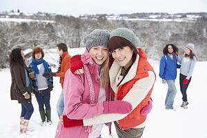 Group Of Young Friends Having Fun In Snowy Landscape