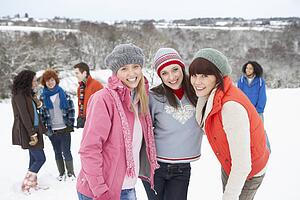 Group Of Young Friends Having Fun In Snowy Landscape