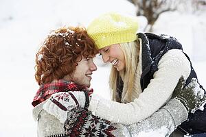 Romantic Teenage Couple Having Fun In Snow