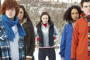 Group Of Teenage Friends Having Fun In Snowy Landscape Wearing Ski Clothing