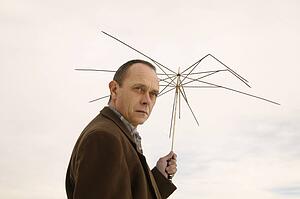 Man holding part of an umbrella