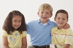 three children in an embrace