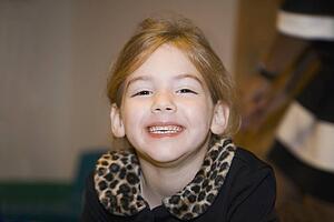 a girl with a big smile