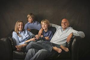 portrait of a family on a couch