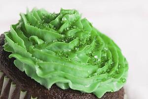 green icing on a chocolate cupcake for saint patrick's day