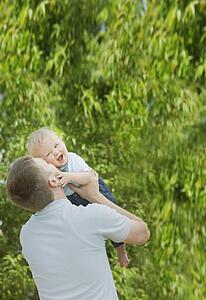 edmonton, alberta, canada; a father playing with his young son