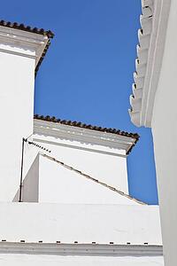 marbella, malaga, costa del sol, spain; roof tops in typical andalusian architecture