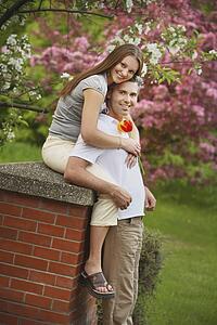 edmonton, alberta, canada; a couple with the woman sitting and the man standing