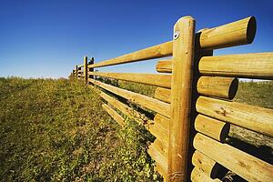 alberta, canada; a wooden rail fence