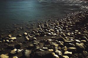 banff, alberta, canada; rocks on the shoreline