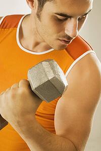 a man lifting a free weight