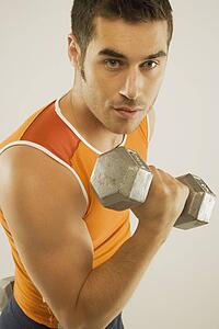 a man lifting a free weight