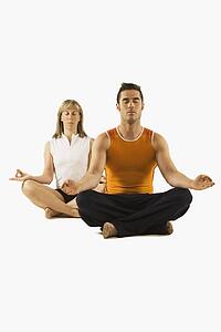 man and woman in a yoga pose
