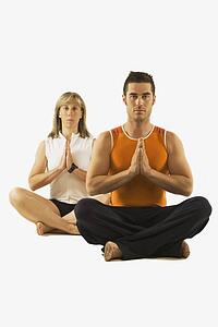 man and woman in a yoga pose