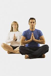 man and woman in a yoga pose