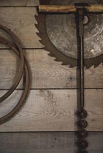 camrose, alberta, canada; old tools hung on a wall
