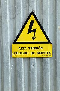 torremolinos, malaga, andalusia, spain; a spanish language sign "alta tension; peligro de muerte" meaning "high tension; danger of death"