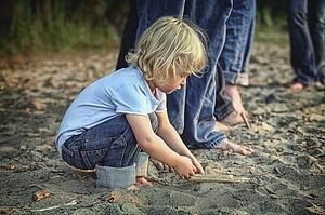 St. Catharines, Ontario, Canada; A Child Playing In The Sand