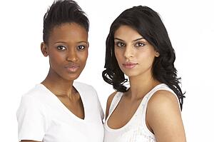 Portrait Of Two Attractive Young Women In Studio