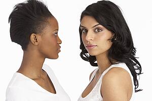 Portrait Of Two Attractive Young Women In Studio