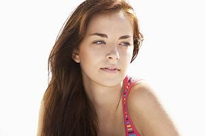 Teenage Girl Relaxing On Beach