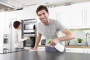 Young Couple Cleaning Cleaning Modern Kitchen 