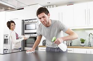 Young Couple Cleaning Cleaning Modern Kitchen 