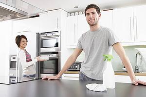 Young Couple Cleaning Cleaning Modern Kitchen 