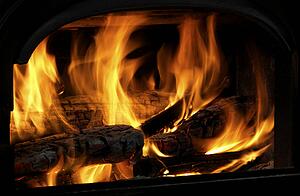 Close Up Of Flaming Logs On Fire