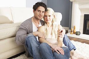 Romantic Young Couple Relaxing Together At Home 