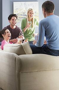 Group Of Friends Enjoying Chinese Takeaway Meal At Home
