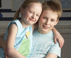 Portrait Of Male And Female Pupils In Classroom