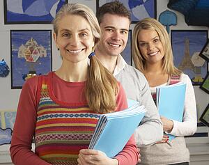 Portrait Of Group Of Teachers In Classroom